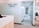 Pearl care dental clinic company logo