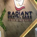 RADIANT DENTAL CARE company logo